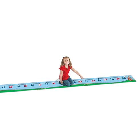 Child playing on Hands On 0 To 30 Number Line Floor Mat For Kids 22 Foot Vinyl Math Path For Counting Addition And Subtraction Practice