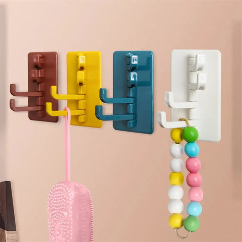 Slick Rotary Sticky Hook Wall Mount With Heavy Duty Adhesive Grip For Keys And Coats No Drill Hassle in various colors on wall.