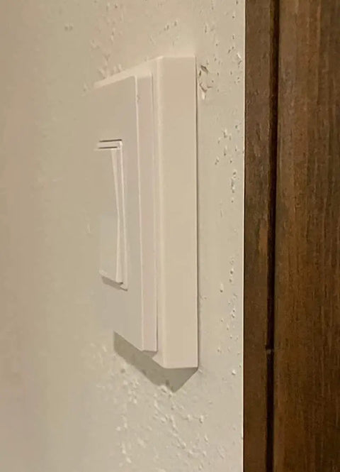 Side view of installed 1-Gang Non-Metallic Shallow Surface Box Extender Five Eighths Inch Lift Paintable White For Outlets And Switches