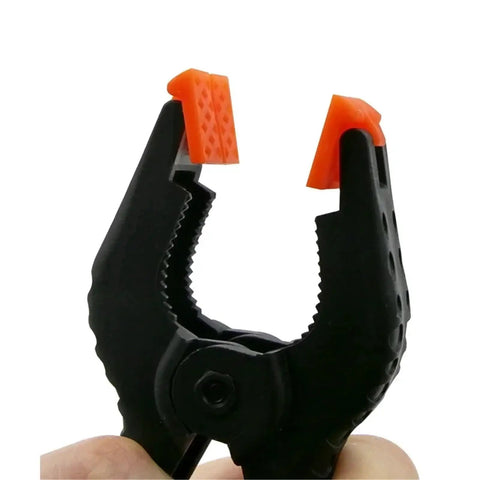 Close-up of Handy Nylon Spring Clamps Set For DIY Woodworking 2 3 4 6 Inch Clips Toggle Clamp Photo Studio And Home Organization