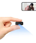 Person holding Ultra Mini WiFi Spy Camera Hidden Nanny Cam With Motion Detection And Night Vision Full HD Video For Home Security