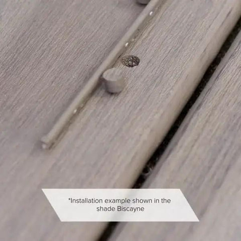 Close-up of Quarter Inch Composite Decking Plugs In Pebble Grey Compatible With Standard Plastic Fastener Systems Pack Of 75 installed on decking.