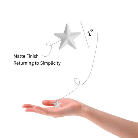 Hand holding White Mini Metal Barn Star 1 Inch with matte finish, part of Set of 27 for Crafts Handcrafted Ornaments with Antique Finish.