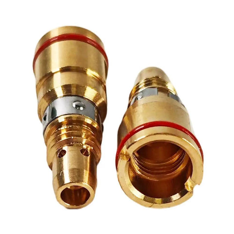 Two brass gas diffusers from a Snazzy 5-Pack Gas Diffuser Fit For Miller MDX Mig Welding Guns, used for welding gas flow control.