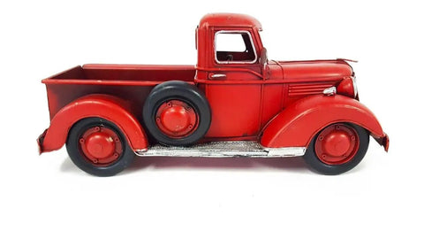 Side view of Red Metal Truck Christmas Decor For Indoor And Outdoor Holiday Cheer With Vintage Rustic Farmhouse Style Pickup Truck Ornament.