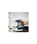 Hand using Kickass Cordless Drill Driver Combo Kit With Solid Battery And Charger for furniture assembly.