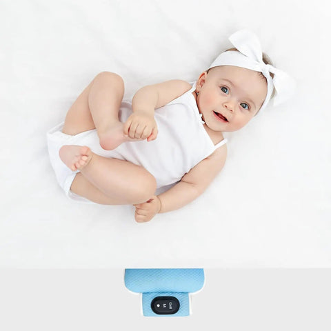 Smiling baby next to Ultimate Baby Sleep Soother with Three Adjustable Vibration Modes and 90 Minute Timer, blue device