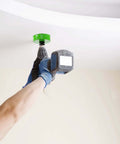 HLOFIZI 4-1/8 inch carbide grit hole saw on drill, green tool, cutting ceiling drywall