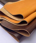 Rock Solid Wide Flat Leather Straps, Knockout Full Grain Cowhide Hide Sheet In Warm Brown Red, 39 By 39 Inches showing layered leather colors.
