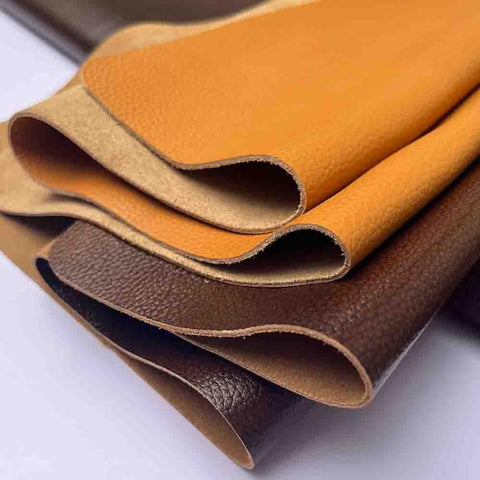 Rock Solid Wide Flat Leather Straps, Knockout Full Grain Cowhide Hide Sheet In Warm Brown Red, 39 By 39 Inches showing layered leather colors.