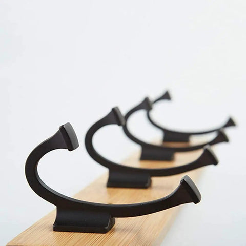 Heavy Duty Wall Mount Coat Rack With Seven Rugged Zinc Hooks For A Slick Entryway And No Sweat Organization Of Puffer Jackets Gym Towels And Baseball Caps, close-up of zinc hooks on a wooden base.