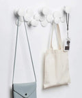 Slick Scandinavian Wall Mounted Coat Hooks Knockout Resin Organizer, white coat hooks with bags, 51cm length, hanging in hallway.