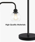 Close-up of Cool Industrial Glass Globe LED Floor Lamp 63 Inch Tall Black Standing Reading Light For Living Room Home Office Bedroom And Study Vintage Minimalist Style With 6W LED Bulb, showing clear glass and black metal base.