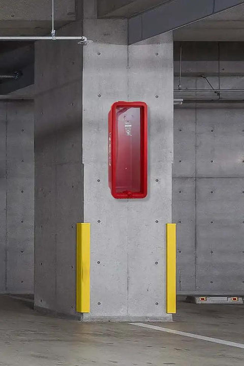 Rock Solid Red Fire Extinguisher Cabinet For 5 Lb Boxes Outdoor Surface Mount on concrete wall between yellow safety posts.