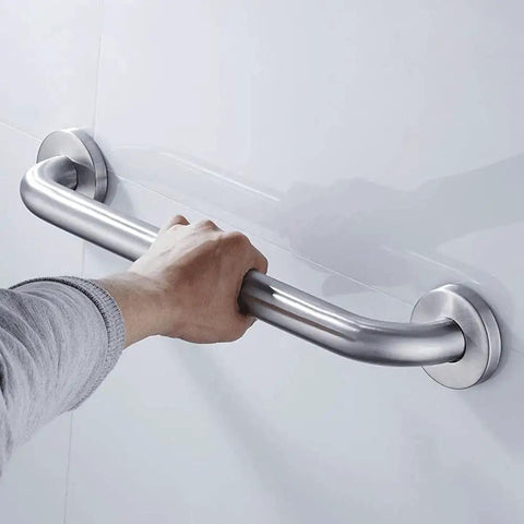 Hand gripping a Heavy Duty Stainless Steel Bathroom Safety Grab Bar With A Tight No Slip Grip For Shower Or Tub Ada Compliant Beefy Handrail Support For Seniors Fly Brushed Finish Eighteen Inch Rig.