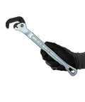 Badass Slim Pipe Wrench Built For Tight Squeezes And Overhead Runs With Heavy Duty 13 Inch Adjustable Spanner held in a gloved hand.