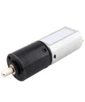 Slick Mini Dc Planetary Gear Motor Featuring Carbon Brushes And A 20Mm Shaft, compact black and silver motor for high torque applications.