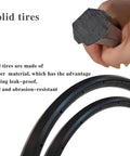 Close-up of solid rubber tire with hand holding cross-section, labeled as leak-proof and abrasion-resistant for wheelchairs.