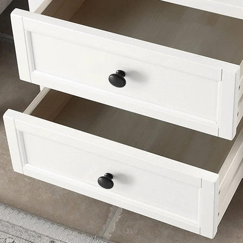 Black Round Cabinet Knobs Set Of 50 Pieces installed on white drawers, 1.2 inch diameter, durable plastic drawer pulls for kitchen cabinets.