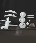 Mini Ornithopter Shaft With Ornithopter Mechanism Kit Components laid out showing gears and rods for power transmission