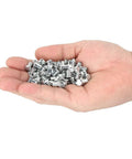 Heavy Duty Tire Stud Screws And Tungsten Steel Anti Slip Nails For Cars Motorcycles ATVs and UTVs in a hand, pack of 100 nails.