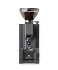 Precision burr grinder in matte black finish with coffee beans, part of Top Tier Home Barista Bundle Pairing A Next Level Espresso Machine.