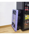 Foldable Flat Bed Cart With Wheels For Home And Courier Use, Heavy Duty Hand Truck On Wheels, Portable Yellow Folding Trolley For Easy Transport, Ready To Roll Compact Cargo Cart For Stockrooms And Workshops, folded purple metal cart by cabinet