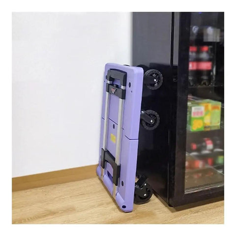 Foldable Flat Bed Cart With Wheels For Home And Courier Use, Heavy Duty Hand Truck On Wheels, Portable Yellow Folding Trolley For Easy Transport, Ready To Roll Compact Cargo Cart For Stockrooms And Workshops, folded purple metal cart by cabinet