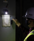 Worker using Rechargeable Two Color LED Headlamp With Durable Fabric Strap, Spotlight And Floodlight Modes, indoor setting.