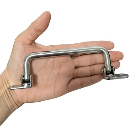 Hand holding 304 Stainless Steel Folding Pull Handle 90 Degree Door and Cabinet Pull Handle, 7 inch length, 6.22 inch hole distance.