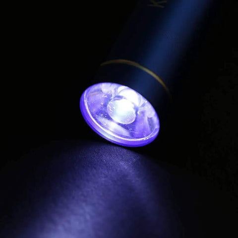UV light component from Pro Level Solder Flux Paste Kit For DIY PCB Repair And BGA Welding, illuminated in the dark.