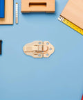 Six Golden Metal Toggle Latches For Vintage Wood Boxes Tool Cases And Suitcases on blue background with tools.