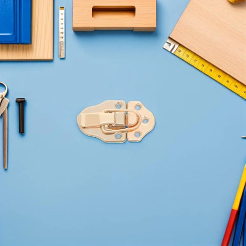 Six Golden Metal Toggle Latches For Vintage Wood Boxes Tool Cases And Suitcases on blue background with tools.