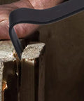 Fifteen Inch Flat Utility Pry Bar With Nail Puller And Chisel Ends for prying wood surfaces, showing its rust-resistant finish