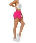Side view of a model wearing hot pink womens running shorts with quick dry fabric featherweight stretch built in brief liner elastic no slip waistband