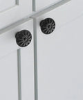 Four Pack Matt Black Kitchen Cabinet Knobs 1.25 Inch Round Zinc Drawer Knobs With Victorian Floral Pattern on cabinet doors
