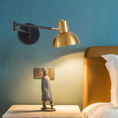 Industrial Metal Swing Arm Wall Sconce With A Sleek Dome Shade And Knockout Build For Cozy Bedroom Or Living Room Reading Vibes E27 Socket Modern Wall Fixture Black Brass Finish mounted above a nightstand.