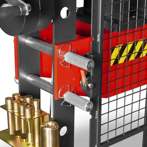 Close-up of the Beefy 30 Ton H Frame Air Hydraulic Shop Press With Hand Winch And Pin Kit, showing steel frame and safety guard.