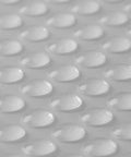Close-up of Heavy Duty Clear Rubber Furniture Protectors Self Adhesive Sticky Bumpers showing smooth, textured surface for grip.