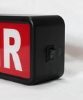 Close-up of On Air LED Recording Light Sign with easy on off switch, black acrylic design for studio or home office decor.