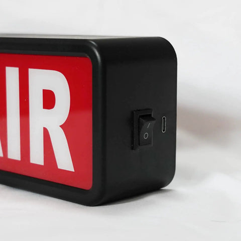Close-up of On Air LED Recording Light Sign with easy on off switch, black acrylic design for studio or home office decor.
