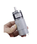 Hand holding DC Planetary Gear Motor 36-555 Miniature Low Speed Adjustable 12V/24V Permanent Magnet Motor With Center Output Shaft