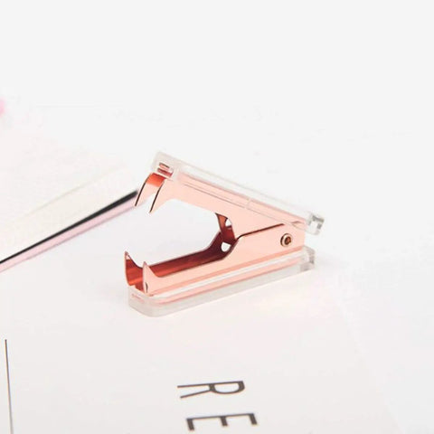 Rose gold staple remover from Two Pack Rose Gold and Gold Staple Remover Set, Luxe Acrylic Office Tools for Quick Paper Fixes, Premium Desk Accessories