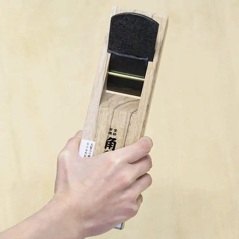 Hand holding Japanese Block Plane 50mm for Woodworking, Kanna Smoothing Plane with Eco Oak Body, Made in Japan