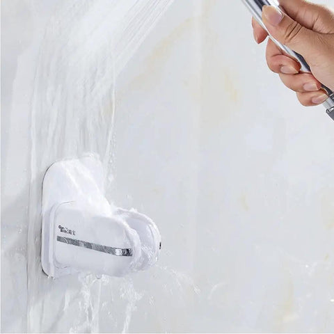 360 Degree Adjustable Shower Head Holder Wall Mount With Tool Free Ultra Strong Adhesive on bathroom wall, hand holding shower head