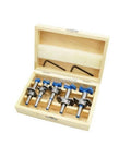 Five-piece Forstner drill bit set in a light wooden storage box with blue collars.