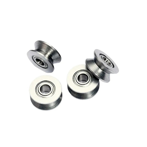 10 Piece V Groove Miniature Bearings And U Shape Pulley Wheels For Wire Guide Tracks with metal U pulleys stacked together.