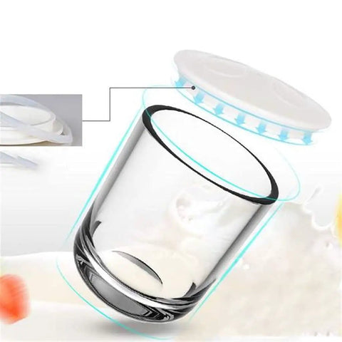 No Sweat Automatic Yogurt Maker With Four Leakproof Glass Jars Smart Constant Heat Fermenter For Silky Homemade Probiotic Dairy And Dreamy Breakfast Bowls You Will Love glass jar with lid for yogurt making, shown with milk inside.
