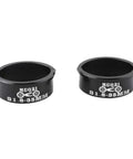 Pair of black aluminum alloy shims 31.8 to 35mm labeled for MTB and road bikes, Aluminum Alloy Handlebar Shim 31 8mm To 35mm Fit For MTB Road Mountain And Fixed Gear Bikes Easy Install Durable Black Upgrade For Smoother Steering And Less Wobble On Everyday Trails