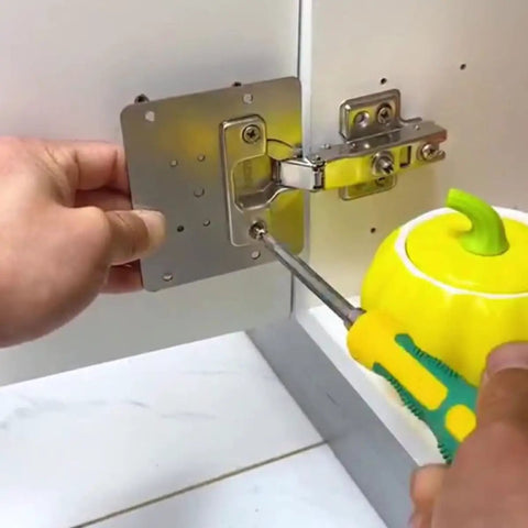 Person installing Stainless Steel Cabinet Hinge Repair Plates With Screws 6 Pack Frameless Cabinet Fixes Durable No Fuss Do It Yourself Friendly